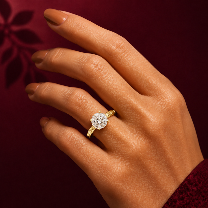 1 carat 6.5mm round lab-grown diamond engagement ring named The Harper featuring a geometric quilted white gold band by The Brillora Jewellery House, isolated on a black background.